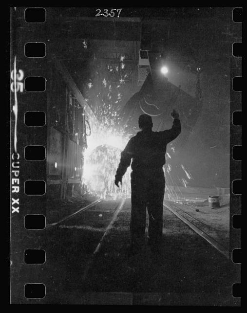 15.-Steel-worker-in-mill-as-molten-steel-spills-from-vat-in-Chicago-Illinois-2.jpg