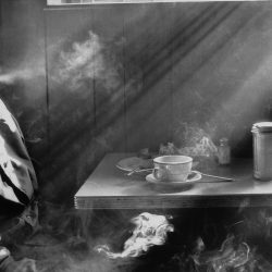 Man Smoking in Diner, 1974