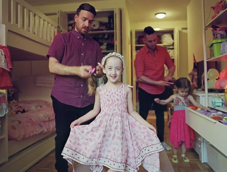 Milo with her fathers and sister. New York City © Bart Heynen from 'Dads' published by powerHouse Books