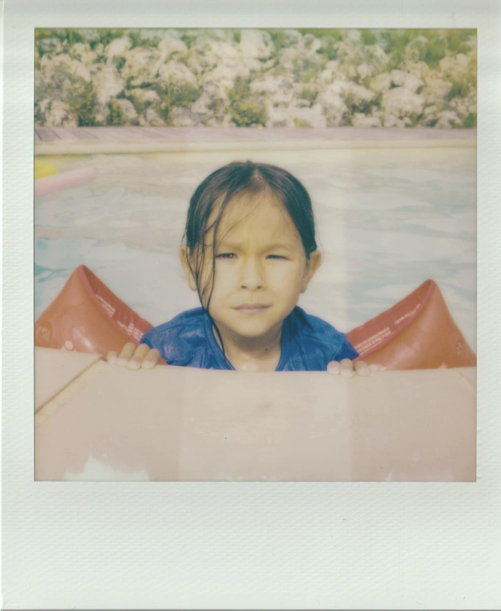 Little girl at the swimming pool