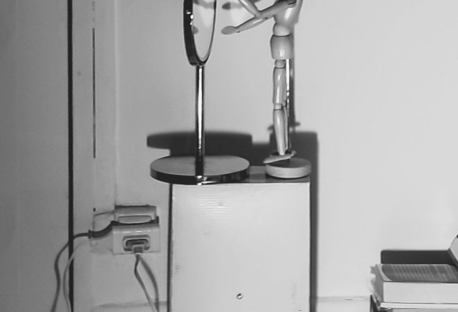 Narcisse se regardant dans un miroir